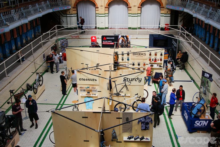 Bespoked manchester 2025 venue with exhibitors in the swimming pool