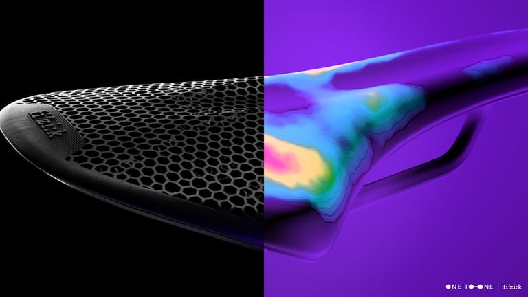 An illustration of a bicycle saddle, with the left half of the image showing the 3D-printed padding lattice, and the right re